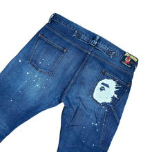 Load image into Gallery viewer, 36" x 34" XL Bape Splatter Ape Head Boot Cut Denim Jeans
